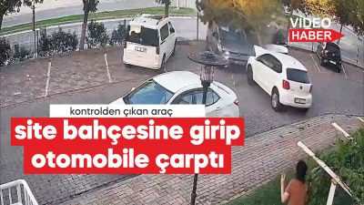 Sürücüsünün kontrolünden çıkan otomobil, site bahçesinin çitlerini yıkarak park halindeki